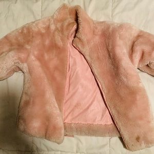 Pink faux fur coat.